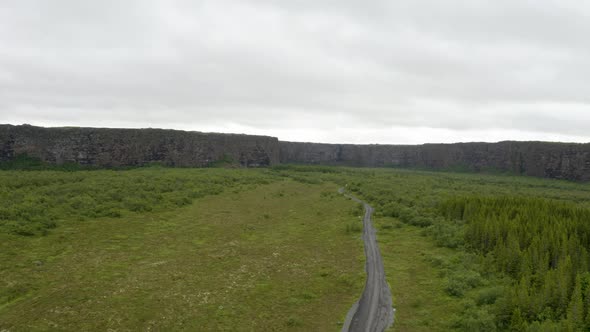 Asbyrgi Canyon With Verdant Vegetation Under Overcast Sky In Iceland. Tilt-up alt