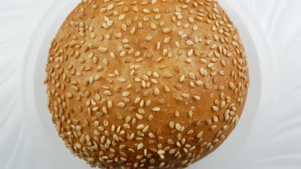 Burger bun with sesame seeds alt