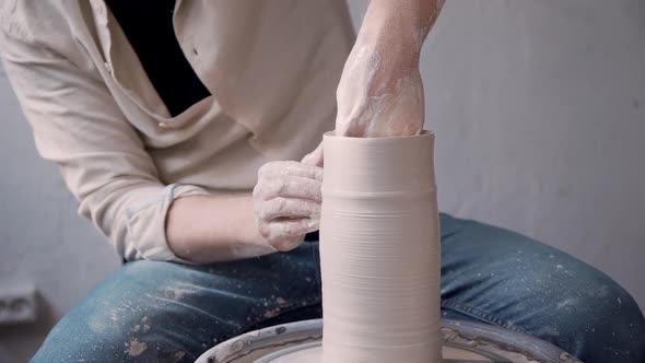 Ceramist Person Making Craft Pottery in Small Workshop Studio