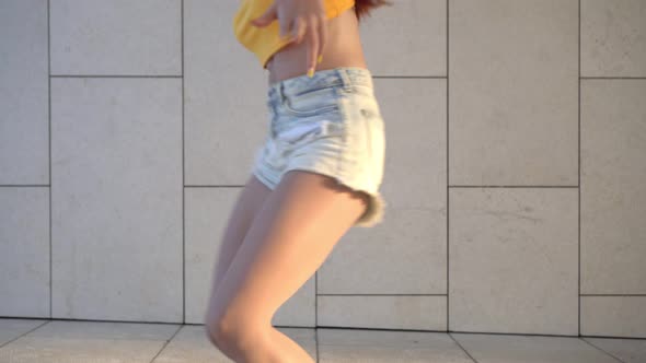 Young Attractive Woman Dancing Hip Hop Outdoors alt