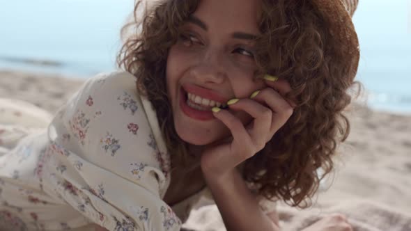 Portrait Smiling Girl Lying on Beach Sand Summer Day alt