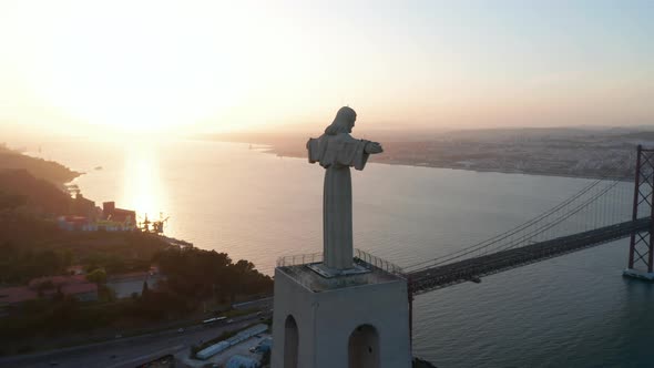 Stunning Aerial Orbit of Sanctuary of Christ the King Statue on the Hill in Evening Light with alt