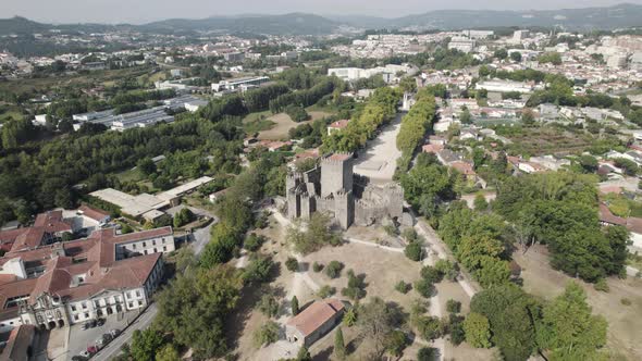 Medieval Guimaraes Castle in Portugal; high angle aerial pan