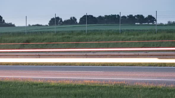 Light Trails of a Cars Driving Fast on a Highway or Motorway