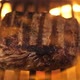 Pork or beef cooked on grill in center of frame. Meat fillet is fried on fire - VideoHive Item for Sale