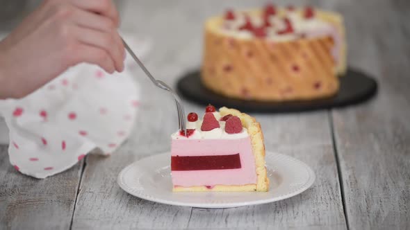 Piece of Layered Raspberry Mousse Cake alt