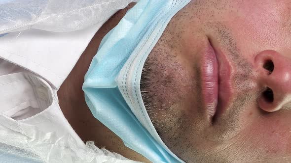 Man in Medical Protective Mask alt