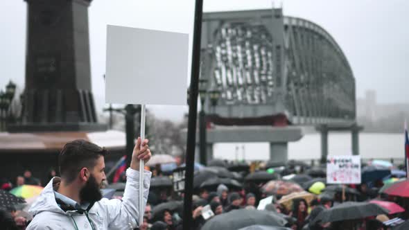 Protest Person Holds Empty Banner for Advertisement alt