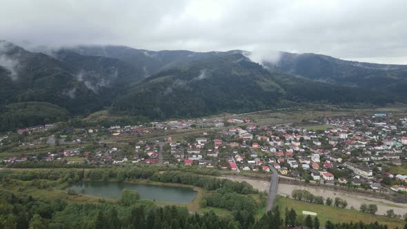 Village in the Carpathian Mountains in Autumn. Slow Motion, Aerial View alt