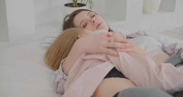 Two lesbians are resting in bed LGBT Gay Lesbian Bisexual Transgender Lesbian concept Love alt