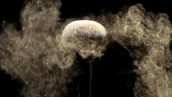 Super Slow Motion Closeup Shot of Makeup Powder Falling From Facial Brush at 1000Fps alt