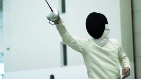 Fencing. Fencer During a Duel. Slow Motion. Kyiv. Ukraine alt