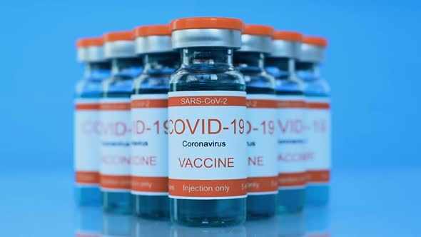 Vaccine COVID-19 In Glass Bottles. alt