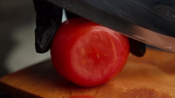 Woman in Black Gloves Cuts Tomatoes at Home Close Up