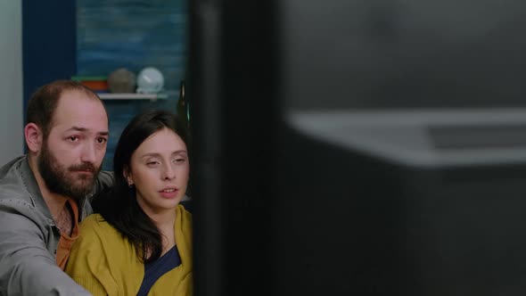 Group of Multi Ethnic Friends Resting on Couch While Watching Celebration Movie alt