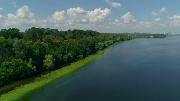 Aerial Drone Footage of Embankment with Dense Forest at Dnipro River