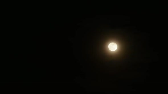 Clouds passing by moon at night. Full moon at night with cloud real time. mystery fairyland scene. alt