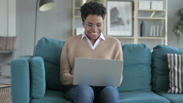 Cheerful African Girl Working on Laptop alt