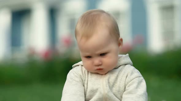 Cute Little Toddler Baby Girl Child Playing in the Garden on Grass at Day Time alt