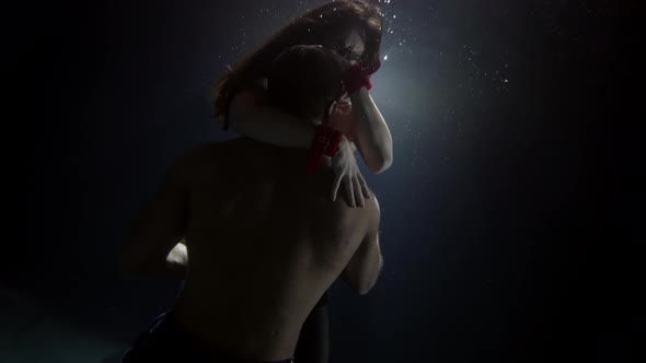 Voluptuous Lovers Underwater Man Is Hugging and Kissing His Slender Girlfriend Muscular Naked Male alt
