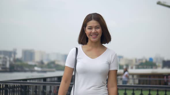 Portrait young Asian woman attractive smile looks at the camera.