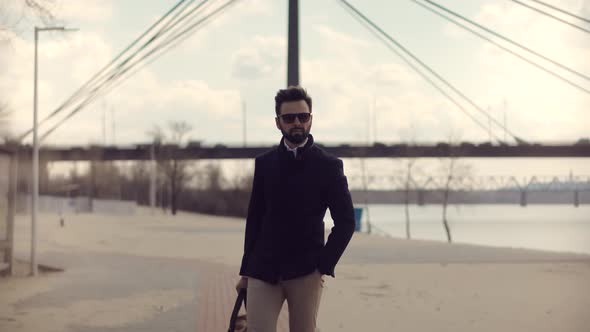 Businessman With Modern Bag Walking City Beach. Well Dressed Stylish Man Relaxing After Hard Working alt