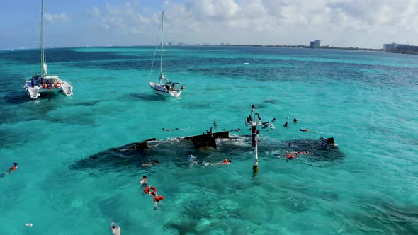 Aerial View of Snorkeling in the Caribbean Sea Near the Sinked Ship alt