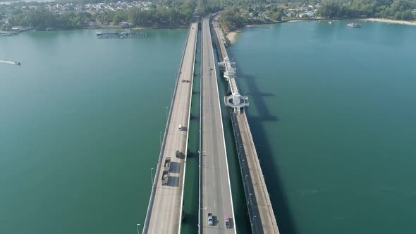 Aerial top view drone shot of bridge with cars on bridge road alt