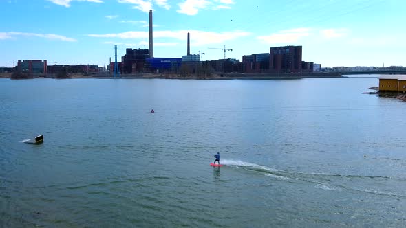 The Man Doing the Surfing on the Bay in Helsinki Finland