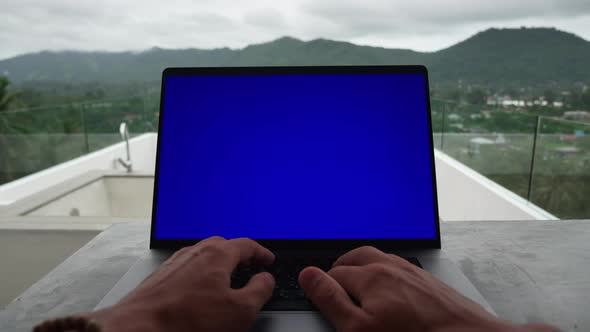 Firstperson Portrait of Business Man Working at Laptop Outside the Office on the Roof of Beautiful alt