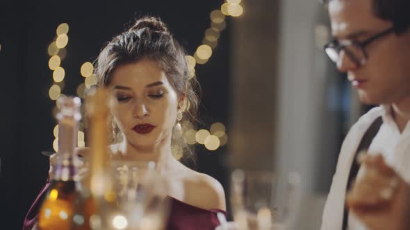 Young Multiracial Guys Drinking Champagne From Glasses and Eating at Party or Celebration Smiling alt