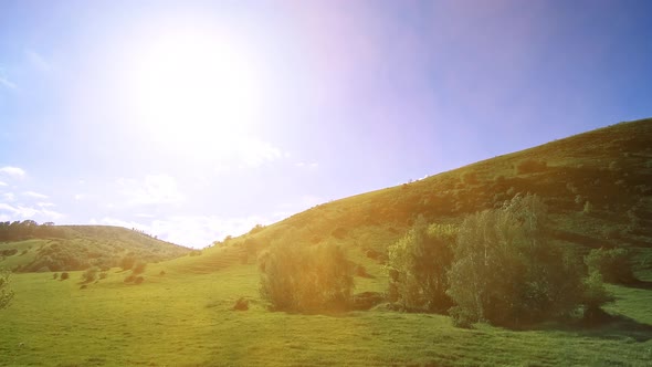  UHD Mountain Meadow Timelapse at the Summer. Clouds, Trees, Green Grass and Sun Rays Movement. alt