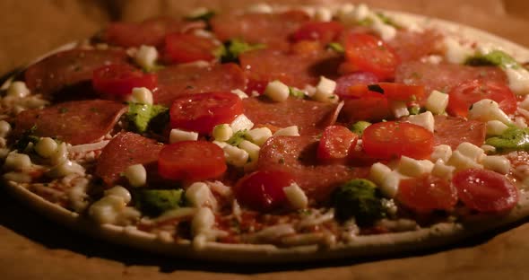 Delicious frozen Italian pizza is bake in the home oven in time lapse