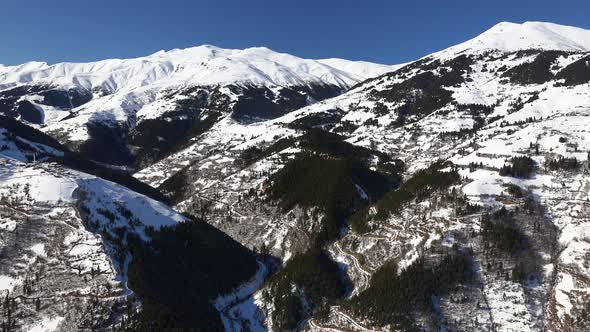 Snowy Winter Landscape of Mountain Villages in the Forest alt