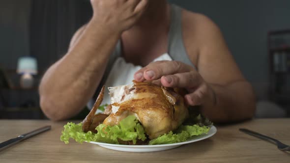 Bad Mannered Man Biting Greasy Fried Chicken and Licking His Fingers Addiction alt