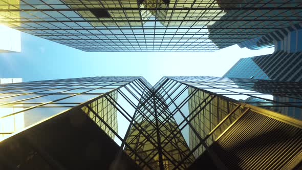 Looking up to High-rise Buildings Skyscrapers Futuristic Architecture Hong Kong City With Blue Sky alt