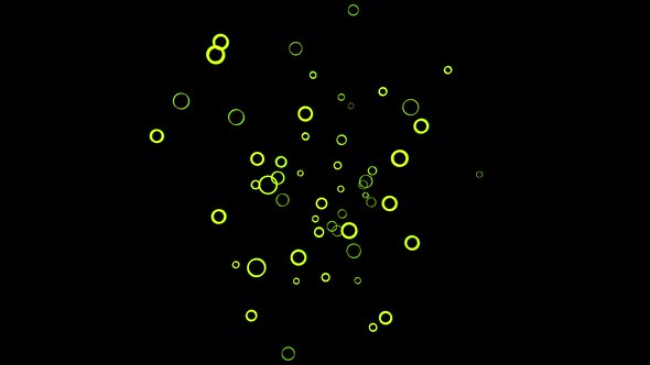 Colorful small green rings floating on black background alt