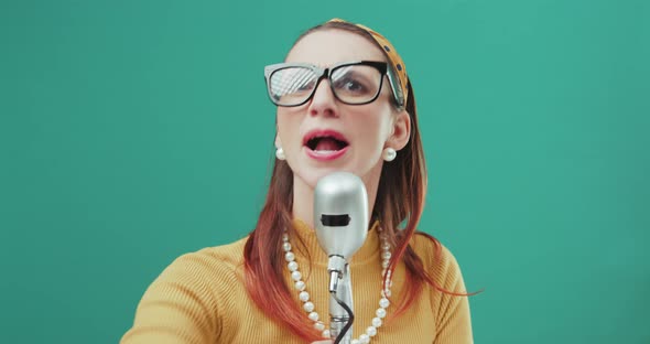 Aggressive vintage style woman giving a speech on a microphone