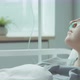 Young Woman with Nasal Cannula Lying in Hospital Ward