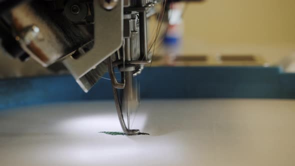Operation of an Industrial Robotic Sewing Machine