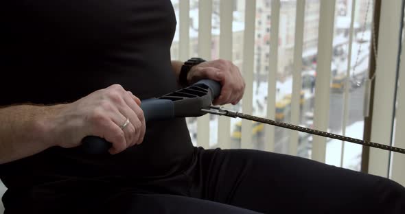 A Man Goes In For Sports In The Gym. Exercises On A Dam Simulator alt