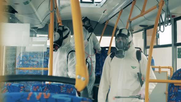 Transport Interior Is Getting Sanitized By a Group of Disinfectors. Covid-19, Coronavirus Pandemic alt