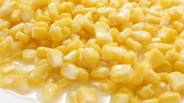 Zea mays sweet healthy food background slow tilt 4K 2160p 30fps UHD footage -  Served on plate corn 