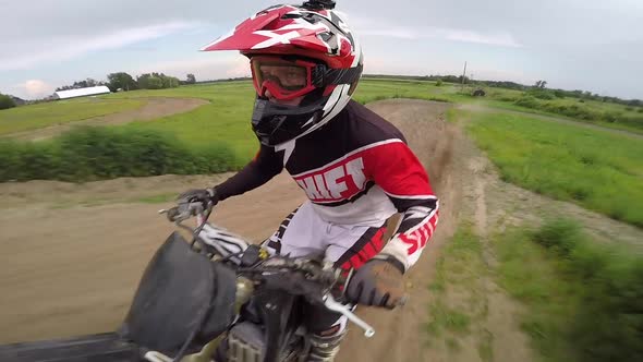 motocross rider giving number one sign in the air over jump selfie gopro slow motion alt