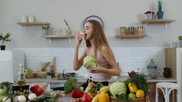 Girl Recommending Eating Raw Vegetable Food. Showing Cauliflower in Hands. Weight Loss, Diet Concept alt
