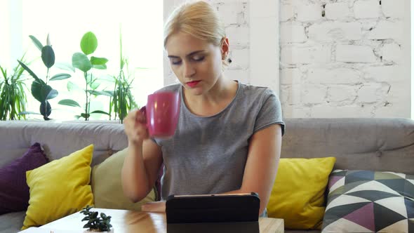 The Girl Is Using Her Tablet alt