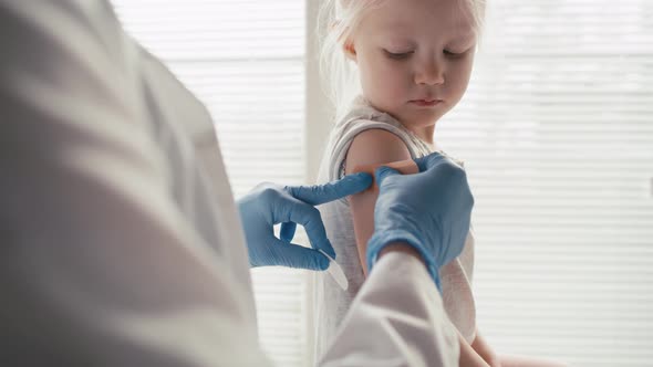 Caucasian elementary age right after vaccination. Shot with RED helium camera in 8K. alt