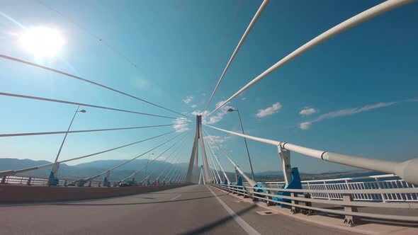 Driving on the Rio–Antirrio bridge. Above Golf of Corinth direction Patras Peloponnese Greece. Offic alt