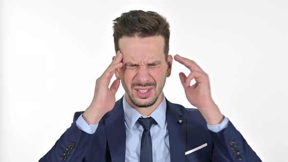 Portrait of Tired Young Businessman Having Headache, White Background alt