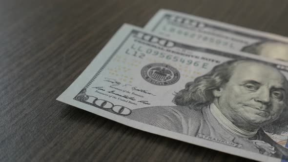 Slow motion American dollar banknotes fall on table close-up 1080p FullHD footage - Counting USD cur alt